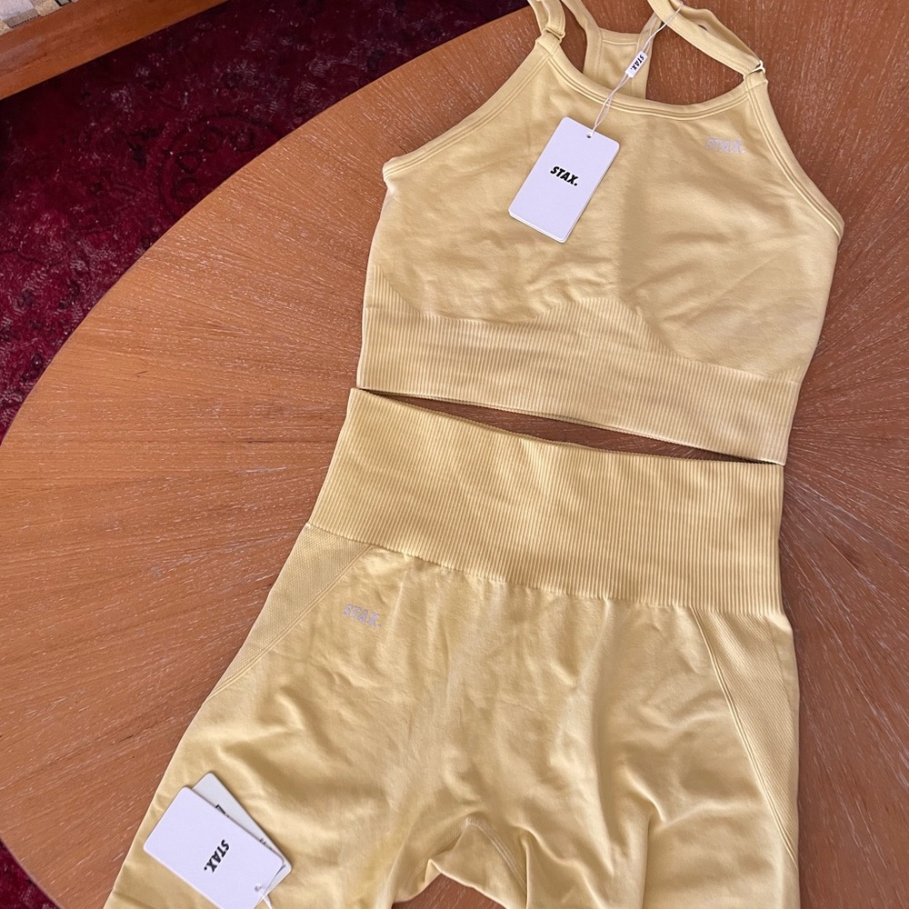 STAX. Large Buttery yellow shorts and crop sports bra top with tags on.